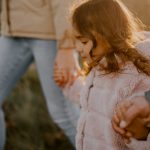 a person holding a child